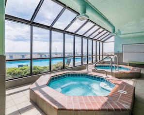 A rooftop pool area with clear views of the ocean and a city skyline. - Phoenix X 1008 1 Bedroom Condo (Orange Beach)