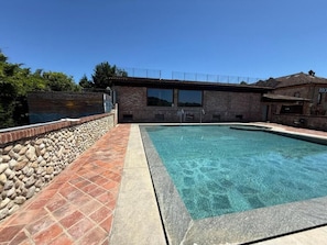 Seasonal outdoor pool, open 10:00 AM to 7:00 PM, sun loungers
