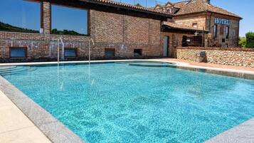 Seasonal outdoor pool, open 10:00 AM to 7:00 PM, sun loungers