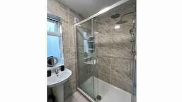 Shower, hair dryer, towels, soap
