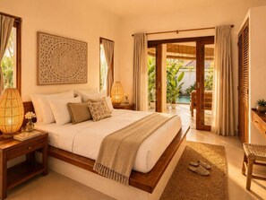 A bedroom with a bed, nightstands, a lamp, a window, and a view of greenery outside. - Villa Juma (Kabupaten Badung)