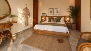 A modern bedroom with a large bed, bedside tables, a desk, and a mirror. - Villa Hibiscus II (Kabupaten Badung)