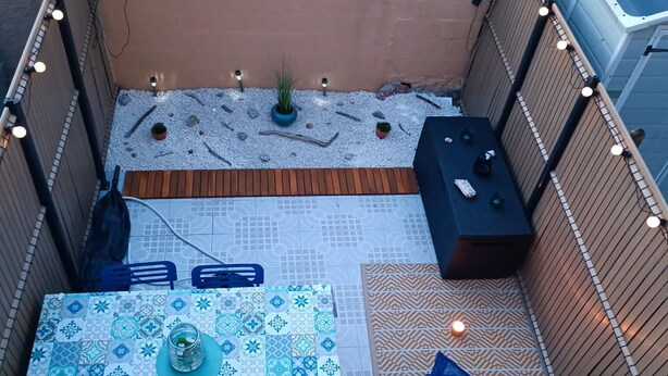 A patio with a table, chairs, a small table, and a blue chair. - Beautiful 2-Bedroom Townhouse, Frontignan, Secure Residential Complex, Beach Access 100 m Away (Frontignan)