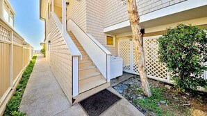A residential building with a narrow pathway, a staircase, and a tree. - On The Sand, Perfect 4 Families, Endless Sunset Views! (Dana Point)