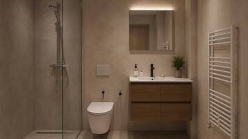 Shower, hair dryer, towels, toilet paper