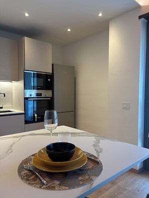 Private kitchen - Nido di Rondine Suite Apartments - TRAMONTO (Nago-Torbole)