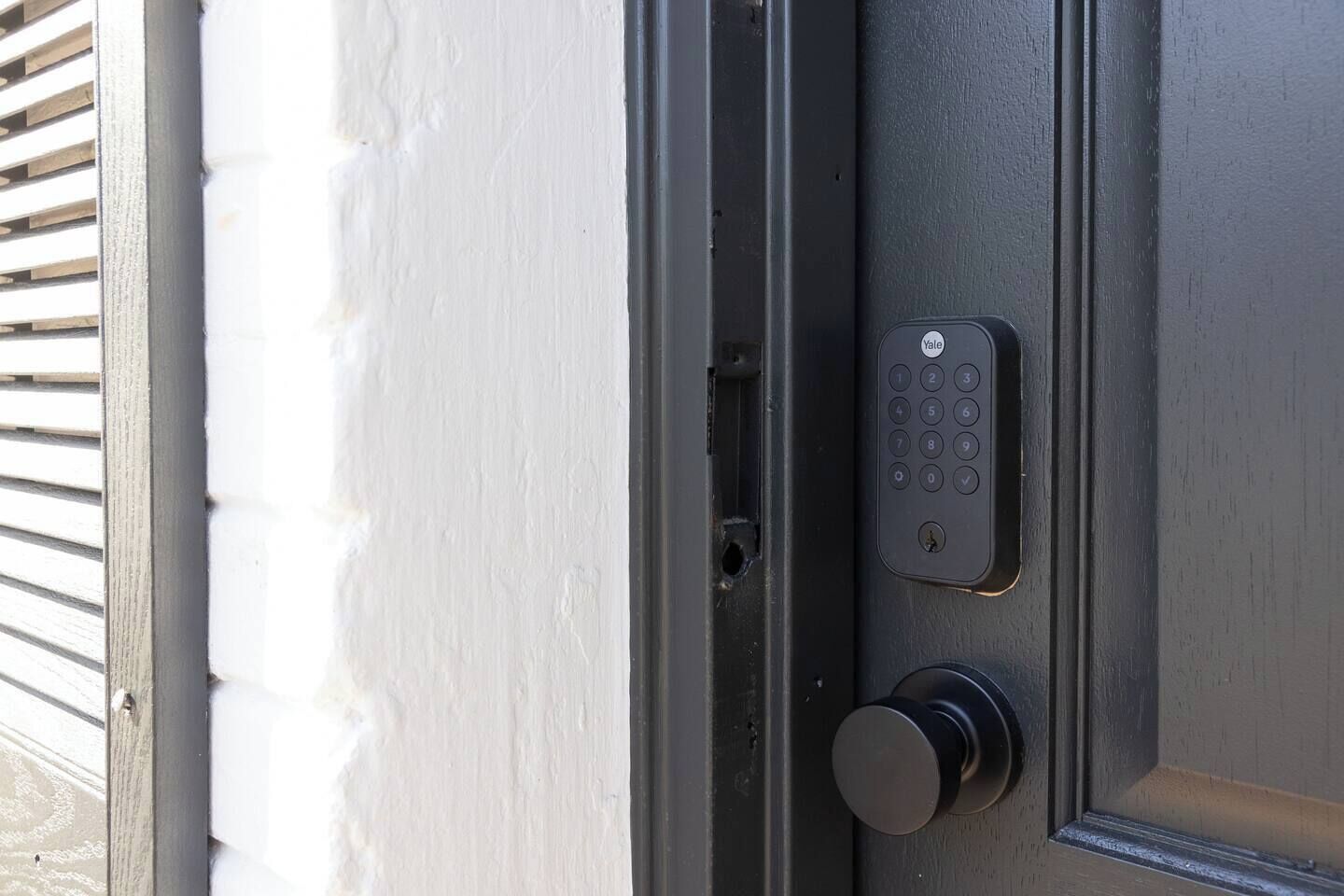 A door with a Yale lock and a keyhole.
