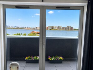 A room with a view of a river and buildings across it. - River Views | 2BR 2BA | Roof Terrace + Parking - Pass the Keys (London)