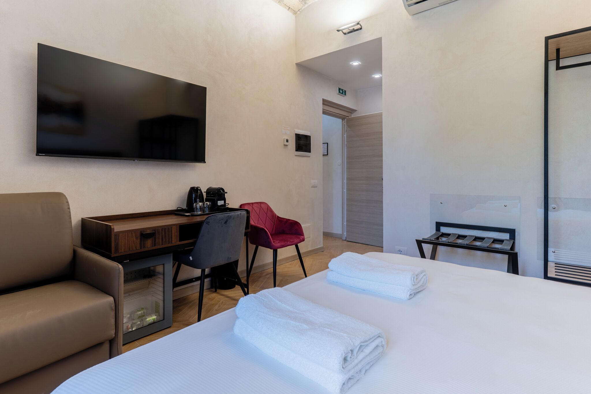 Superior Quadruple Room, City View | Minibar, in-room safe, desk, laptop workspace