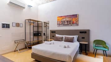 Deluxe Triple Room, City View | Minibar, in-room safe, desk, laptop workspace