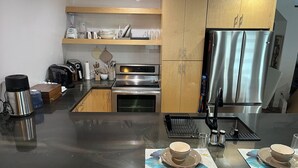 Coffee/tea maker, fridge, microwave, oven