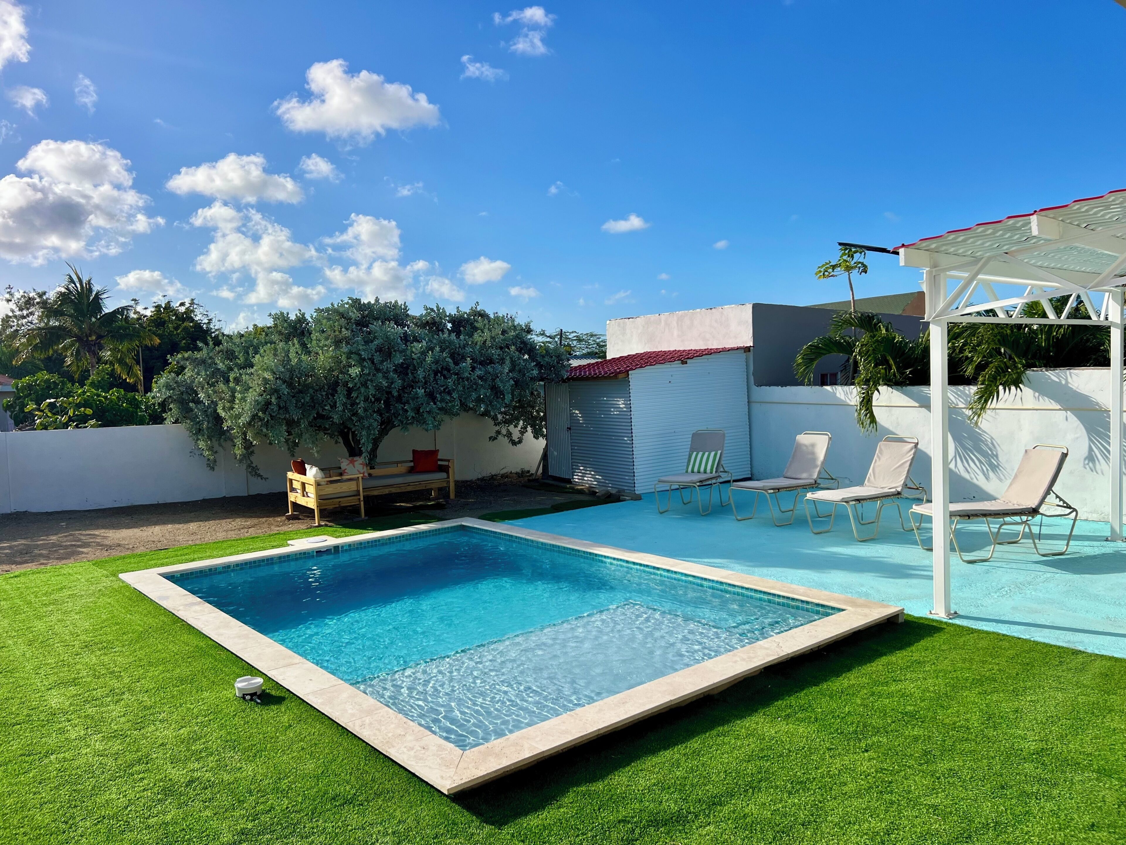 Outdoor pool, pool umbrellas, pool loungers