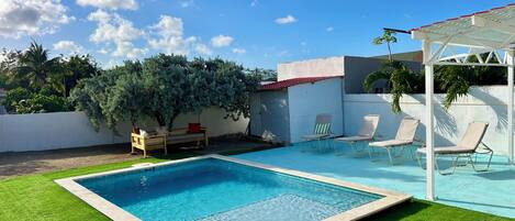 Outdoor pool, pool umbrellas, sun loungers