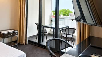 Suite, 1 King Bed, Balcony, City View | In-room safe, desk, laptop workspace, free WiFi