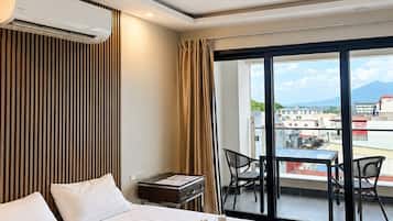 Suite, 1 King Bed, Balcony, City View | In-room safe, desk, laptop workspace, free WiFi