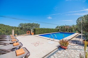 A rooftop pool area with lounge chairs and a lifebuoy. - Villa near Pollensa Old Town (Pollensa / Pollença)