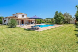 A house with a swimming pool, outdoor seating, and a garden. - Nice villa near centre of Pollença (Pollensa / Pollença)