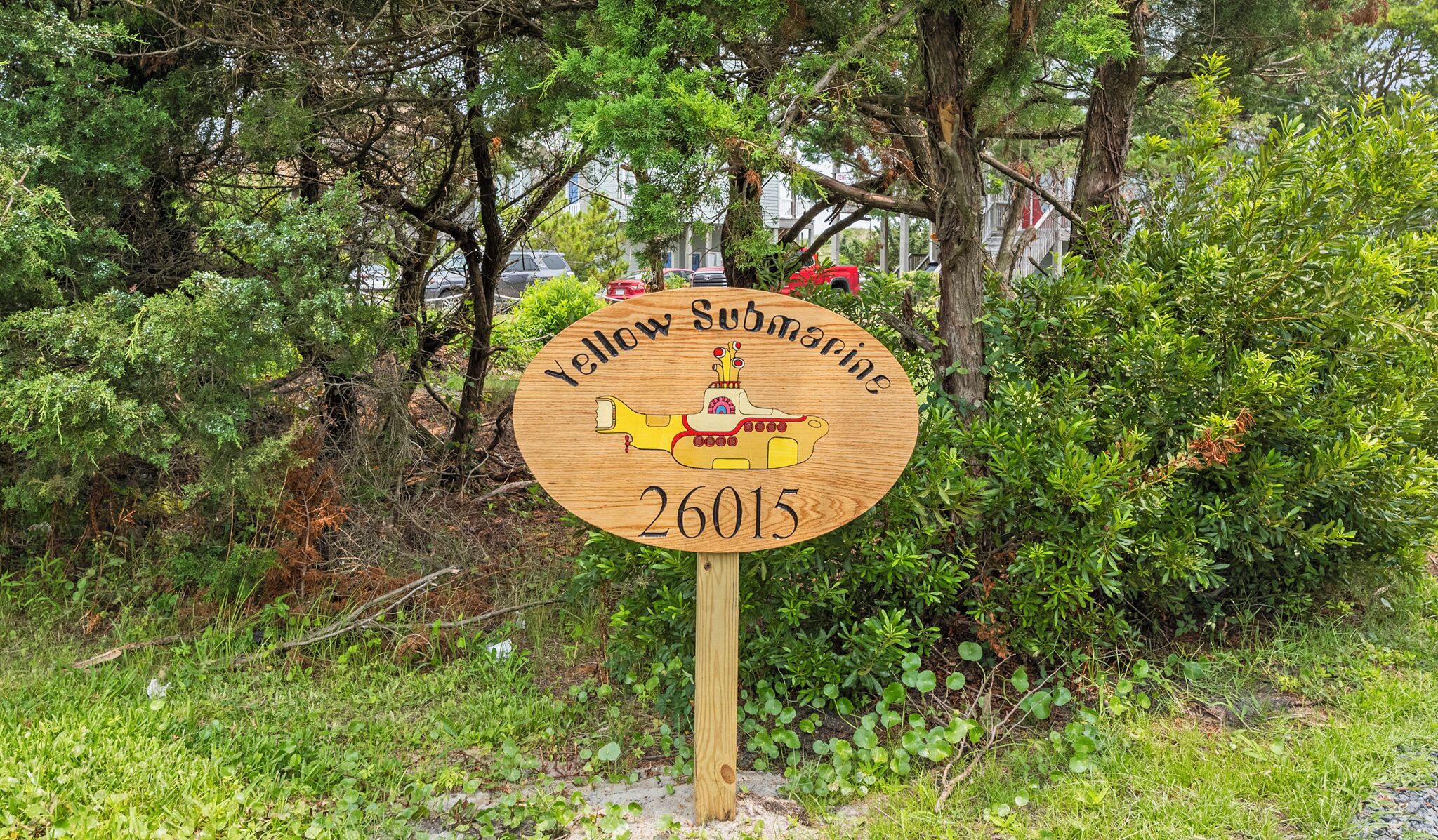 A wooden sign with a yellow submarine illustration and the text 'Yellow Submarine 26015'.