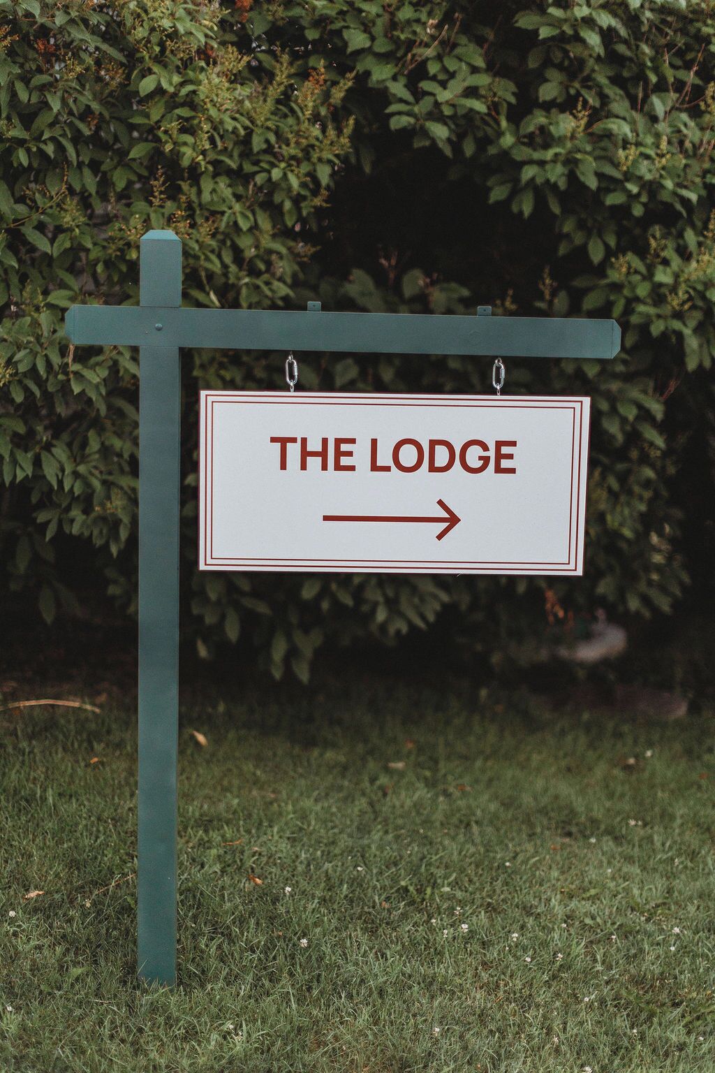 A directional sign for 'THE LODGE' with an arrow pointing to the right.