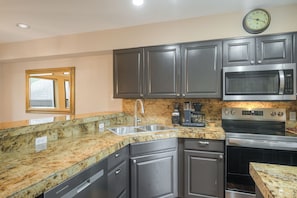 Coffee/tea maker, fridge, microwave, oven