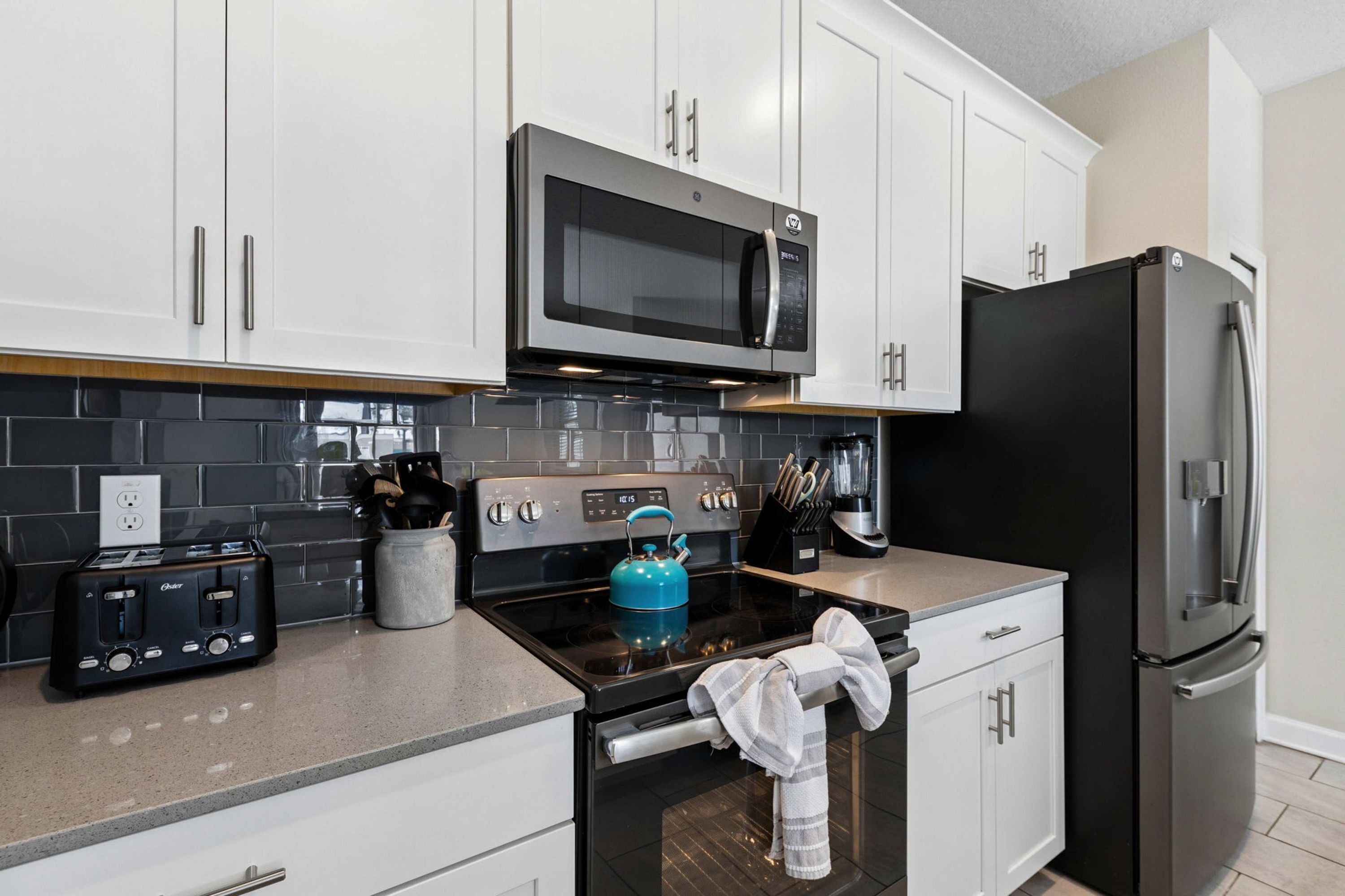 Coffee/tea maker, fridge, microwave, oven