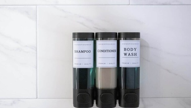 Three bottles of hair care products on a tiled surface. - Renovated Cottage near Beach & City Dogs Welcome! (Savannah)
