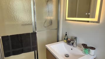 Shower, hair dryer, towels, soap