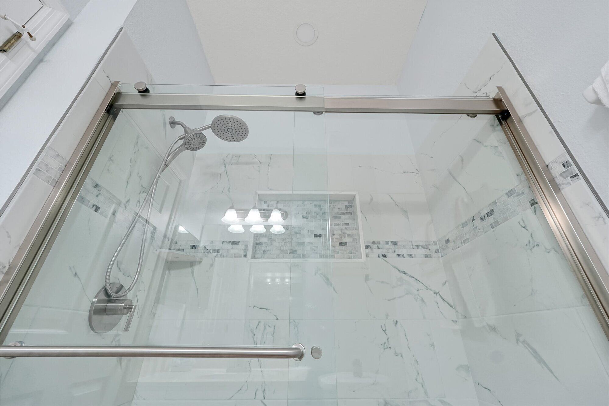 Bright guest bathroom with fresh towels provided.
