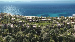 A resort with multiple buildings, palm trees, and a beach. - Omni Pontoque Resort At Punta De Mita (Punta de Mita)