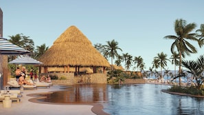 A resort with a large pool, lounge areas, and thatched-roof structures. - Omni Pontoque Resort At Punta De Mita (Punta de Mita)