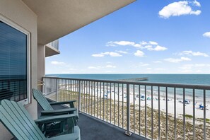 A balcony with a view of a beach, a pier, and the ocean. - Summerwind West 804 (Navarre)