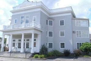 A two-story building with a balcony on the first floor, large windows, and a nameplate reading 'GOODIDGE PLACE'. - Downtown Lincoln. Park once. Walk every where. Minutes to Loon. Pet friendly, (Lincoln)