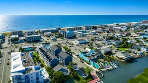 An aerial view of a coastal town with buildings, roads, and a marina. - Spacious 4-bedroom townhome in fabulous Ocean City with AC (Ocean City)