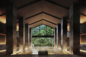 A spa area with a large window, stone pillars, and a water feature. - HOTEL THE MITSUI HAKONE, a Luxury Collection Hotel & Spa (Hakone)