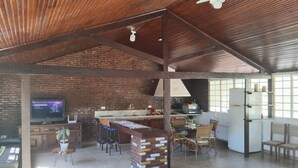 A spacious open-plan living area with a kitchen, dining area, and seating space.