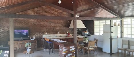 A spacious open-plan living area with a kitchen, dining area, and seating space.