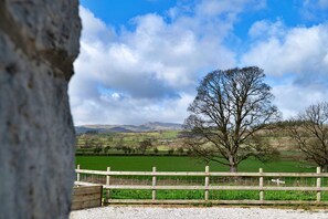 A rural landscape with a prominent tree in the foreground, a wooden fence, and rolling hills in the background. - Luxury Lodge With Swim Spa for 8 (Bala)