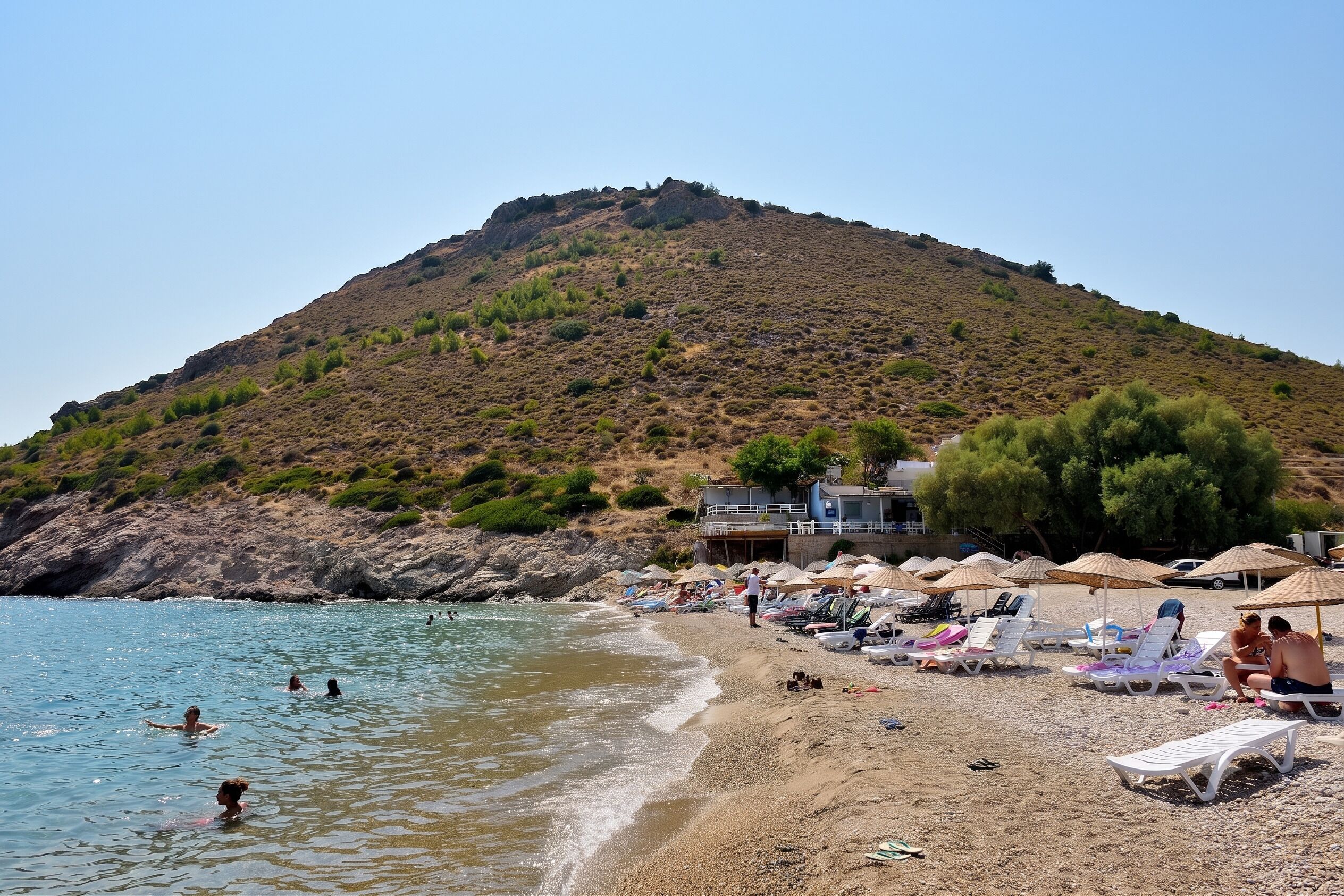 On the beach, sun loungers, beach umbrellas, beach towels