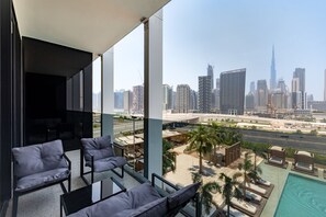 A balcony with a city skyline view, including a prominent skyscraper. - Sleek Studio w/ Burj Khalifa View (Dubai)