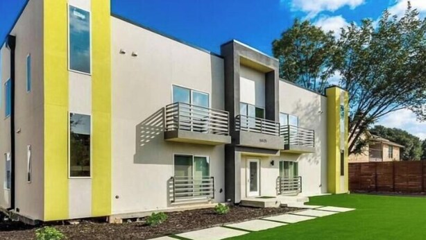 A modern two-story building with a balcony on the second floor. - Modern Luxury-Lower Greenville (Dallas)