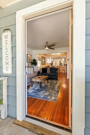 A doorway leading into a room with a ceiling fan, a sofa, and a coffee table. - 3 BD/ 2 BA/ Saint Augustine (311 FB) (Saint Augustine)