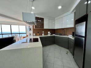 Coffee/tea maker, fridge, microwave, oven
