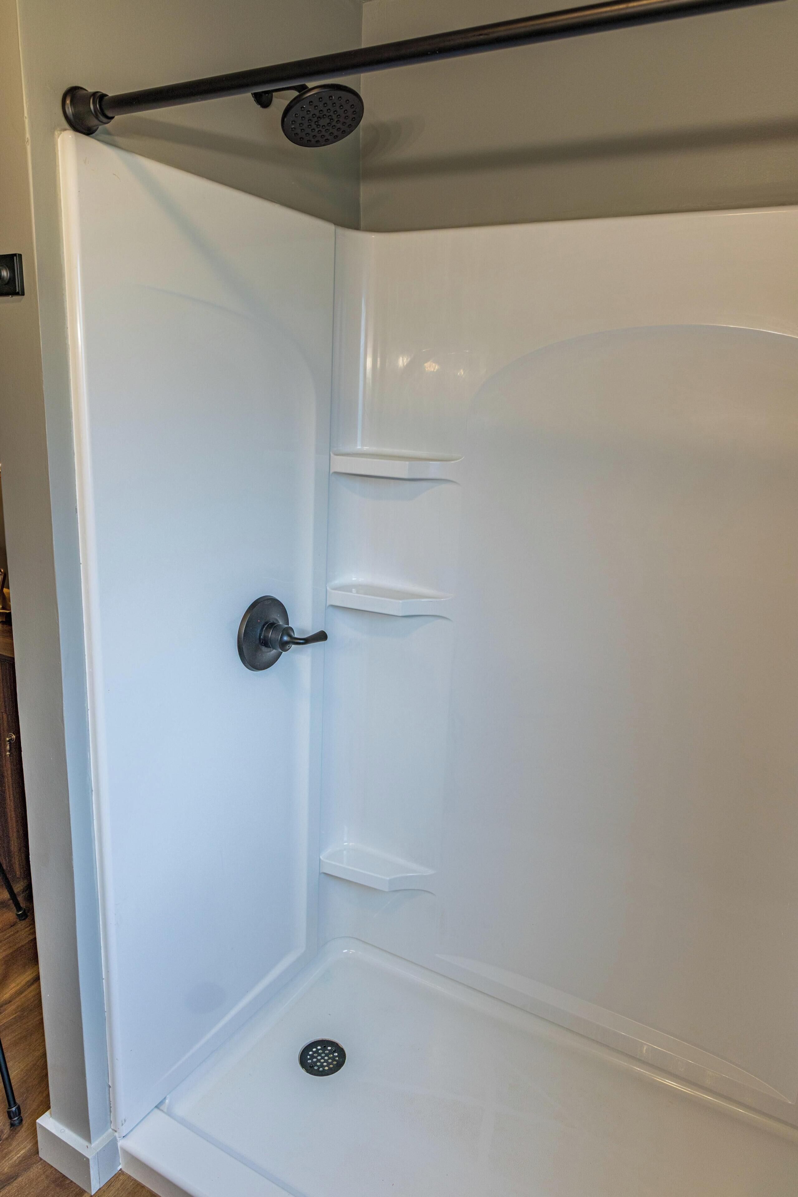 Shower, hair dryer, towels, shampoo