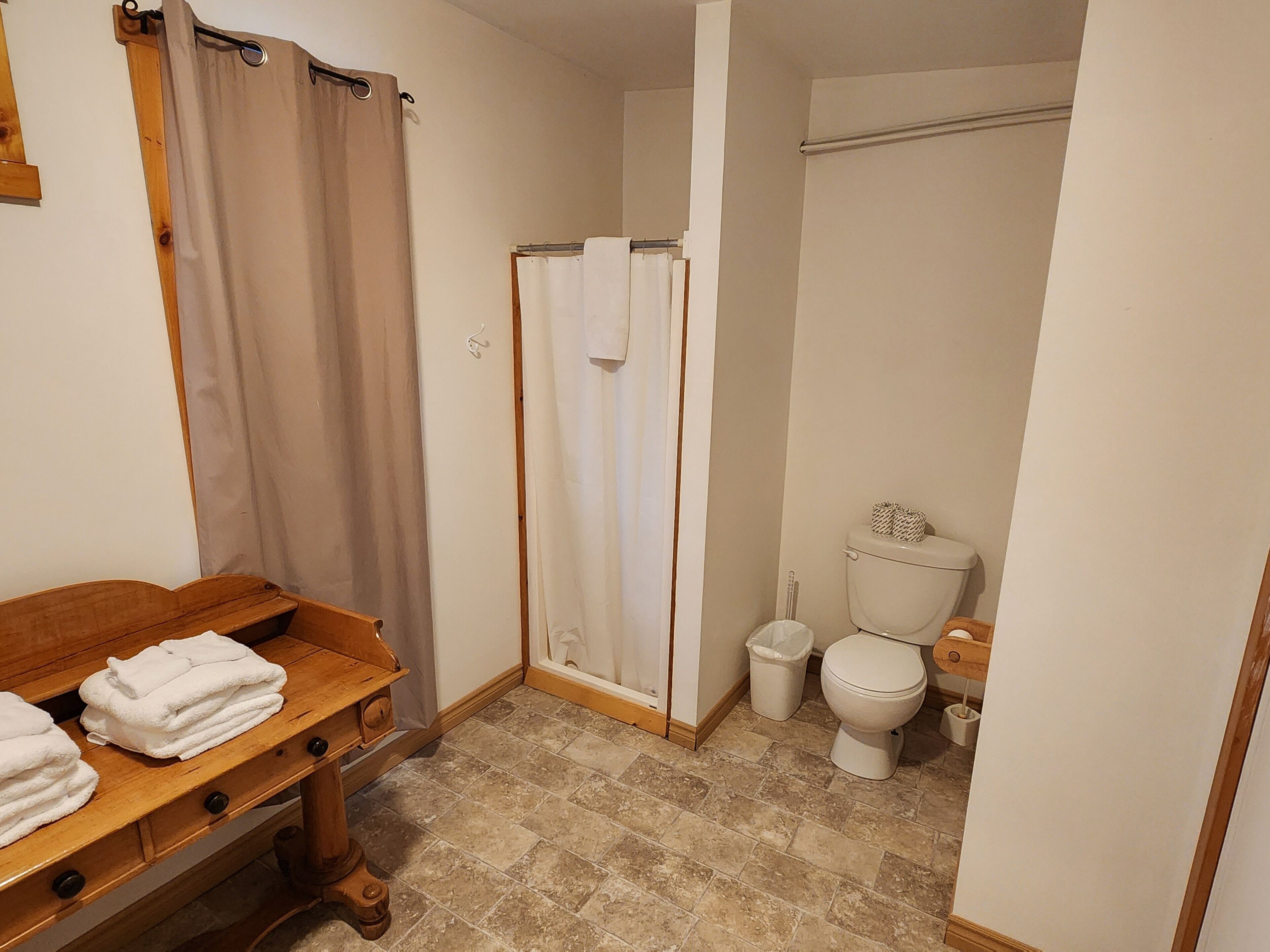 Shower, towels, soap, toilet paper