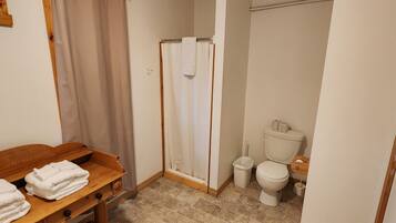 Shower, towels, soap, toilet paper
