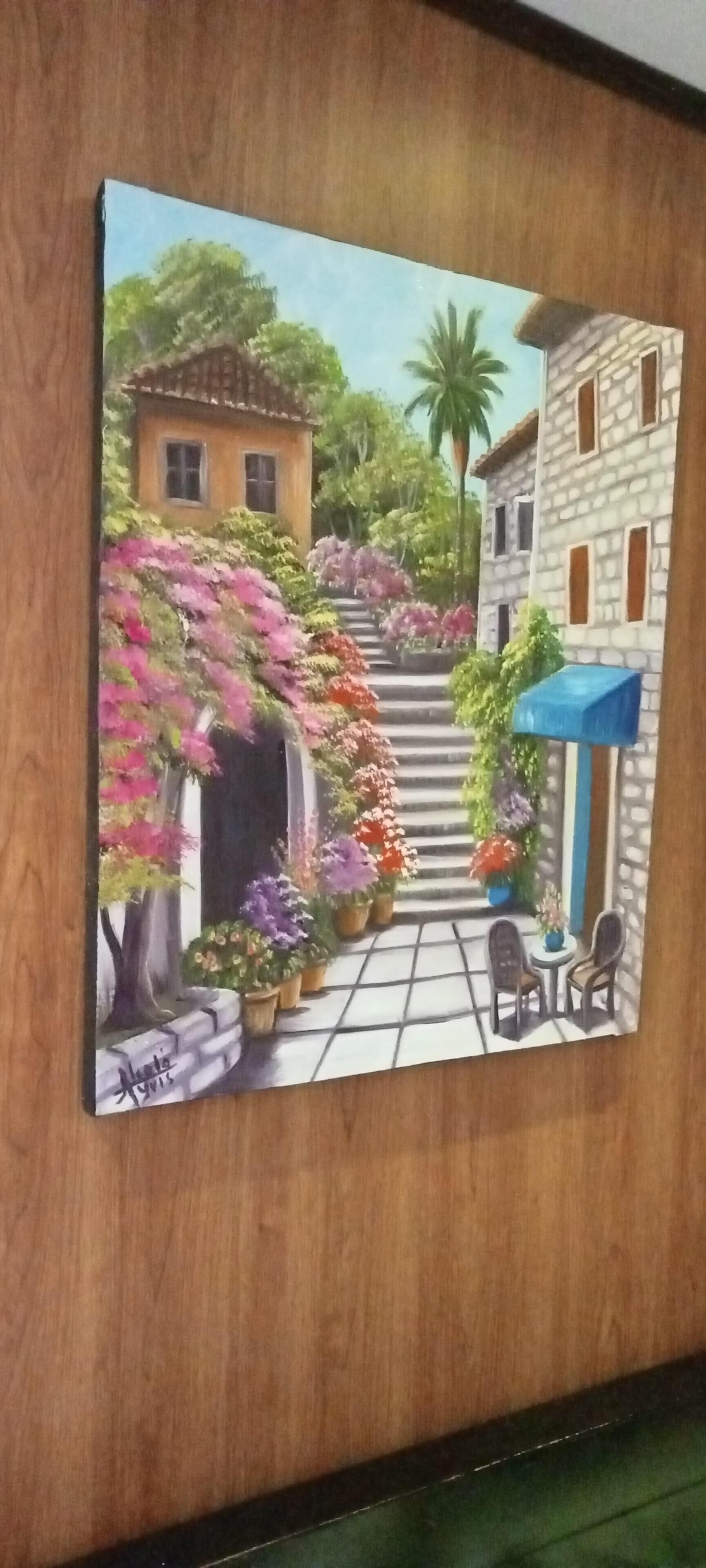 A painting of a courtyard with a staircase, potted plants, and a table with chairs.