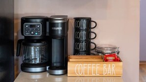 A kitchenette with a coffee maker, a Keurig, and a coffee bar sign. - Lake Front! Hot Tub, Fire Pits, Game Room (East Stroudsburg)