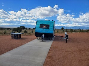 Outdoor dining - Uranus Camper Suite - Planet-themed camper suite with awning deck, sleeps up to four (Penrose)