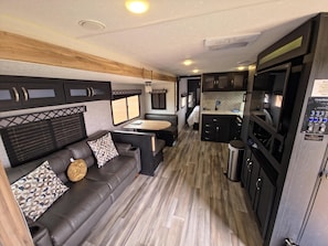 Living area - Saturn Camper Suite - Family planet camper with bunk beds, sleeps six (Penrose)