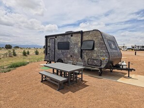 Outdoor dining - Mercury Camper Suite - Planet-themed camper suite with awning deck, sleeps three (Penrose)
